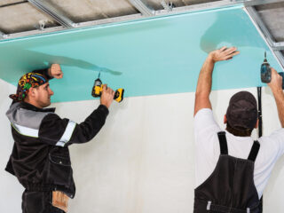 plasterboard-installers-men-assembling-drywall-false-ceiling-simple-affordable-renovation-premises